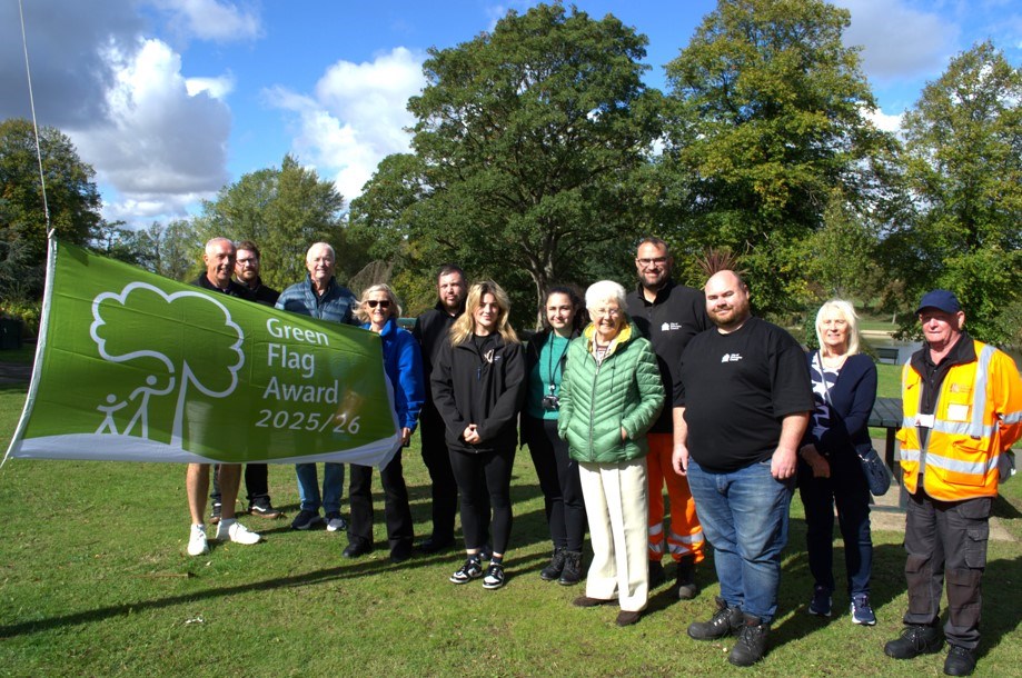 People standing by the Green Flag for Sandall Park